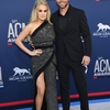 carrie-underwood-and-mike-fisher-attend-the-54th-academy-of-news-photo-1141081238-1554678715.jpg